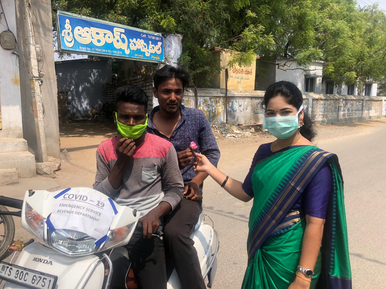 women sarpanch distributed flowers to people