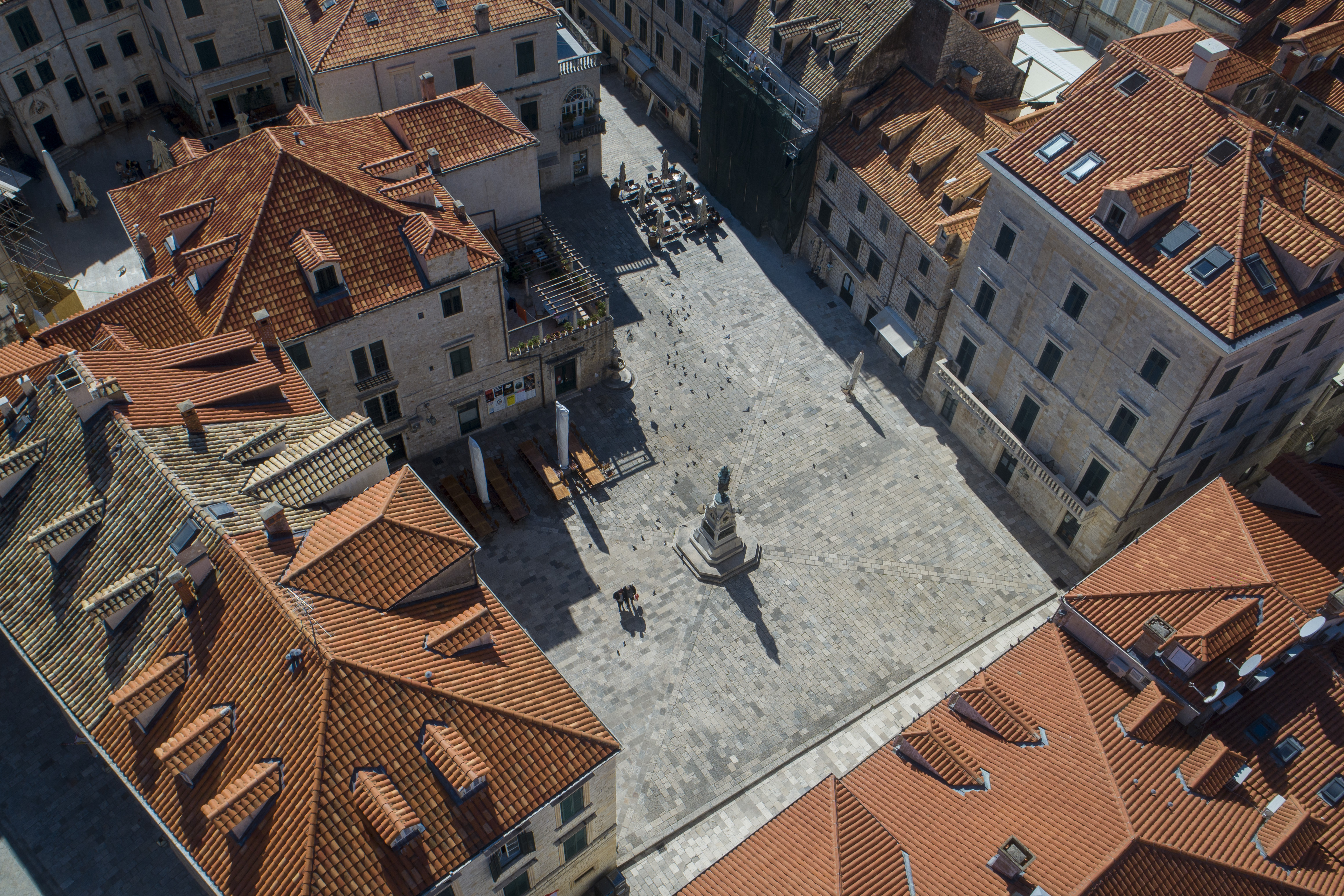 In this Tuesday, March 17, 2020 file photo, an aerial photo of a square and restaurants in the medieval old town of Dubrovnik, Croatia.