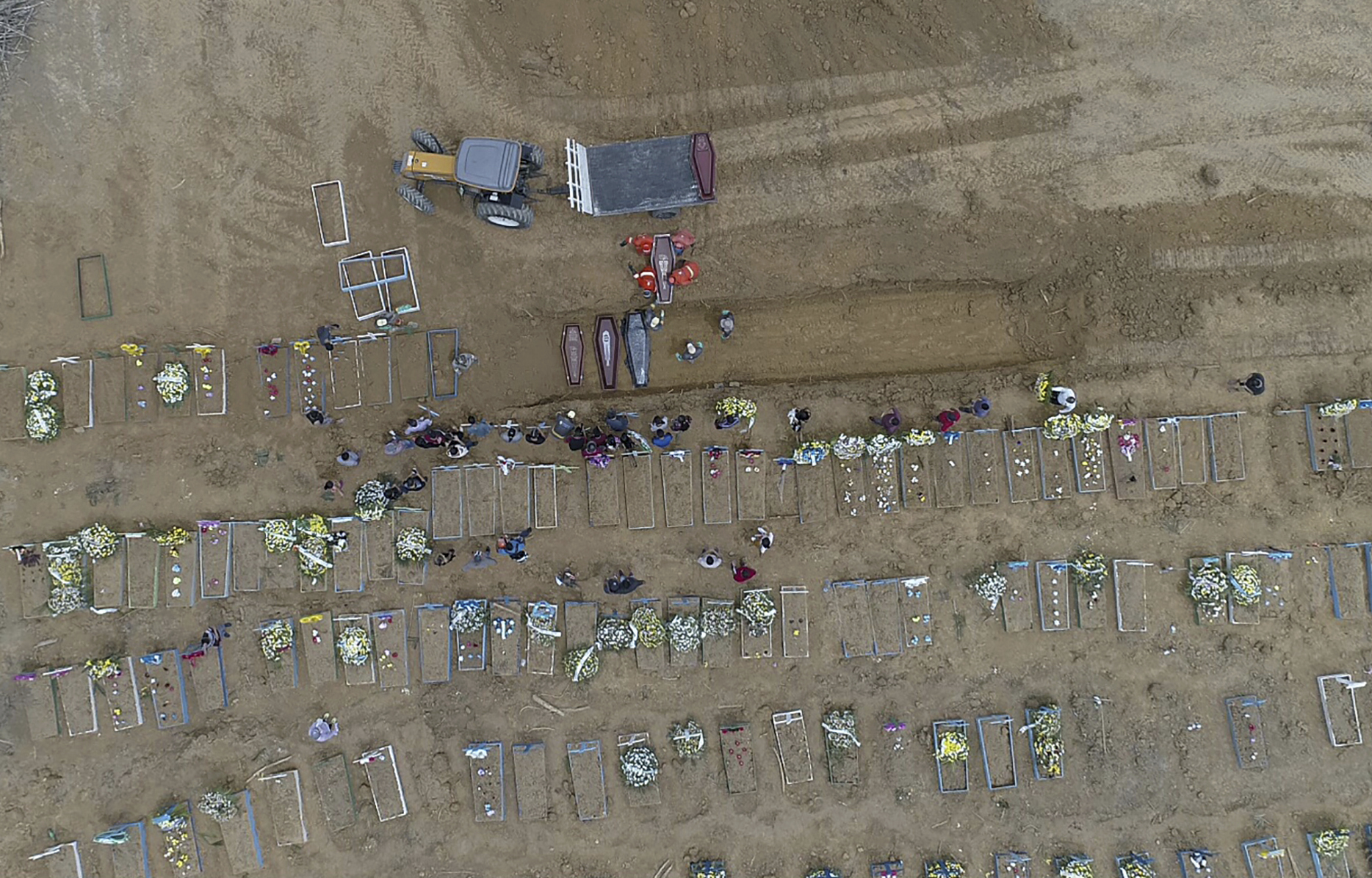 Dozens of coffins arrive at Brazil mass grave