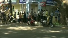 People line up at a liquor shop in Bengaluru as state government permits the sale of liquor