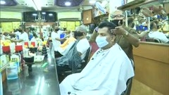 People line up at a liquor shop in Bengaluru as state government permits the sale of liquor