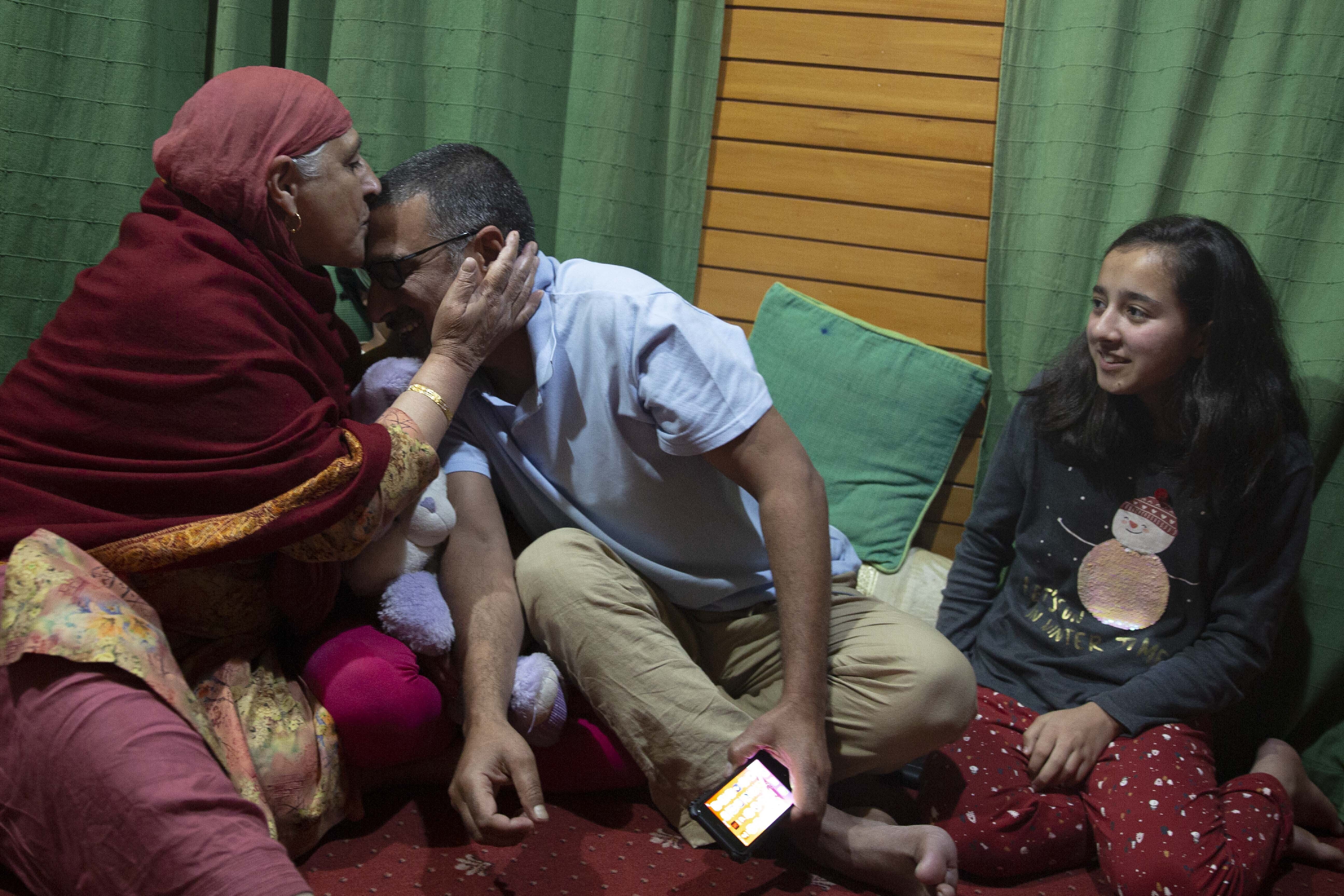 Dar Yasin celebrates with his family at his home in Srinagar