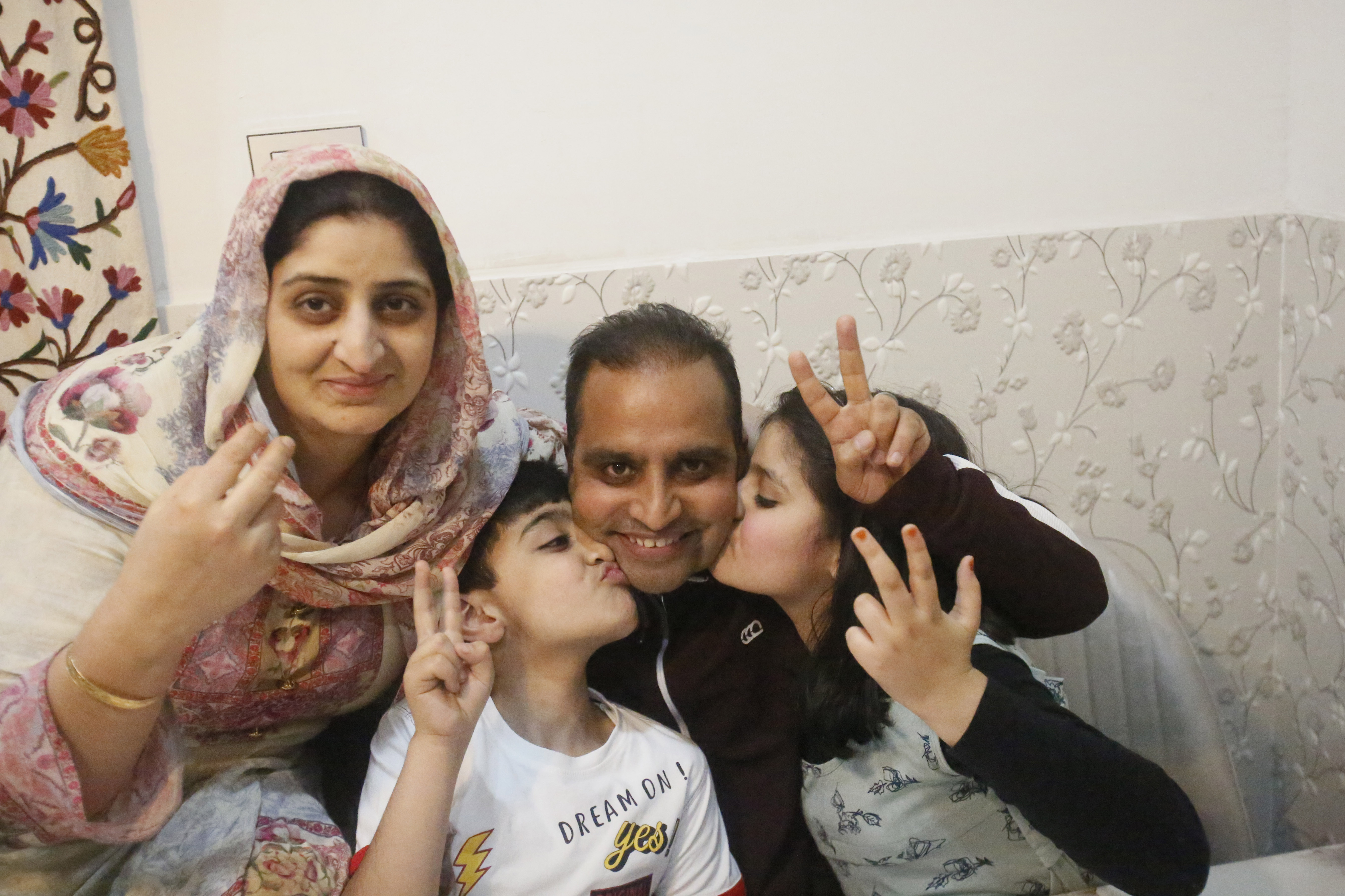 Mukhtar Khan celebrates with his family at his home in Srinagar