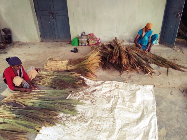 Self help group women selling broom