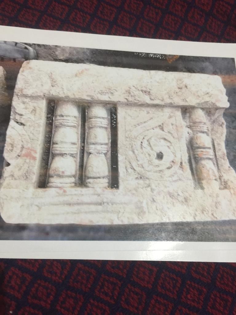 Discovered pillars in debris of the structure and carvings on sandstone