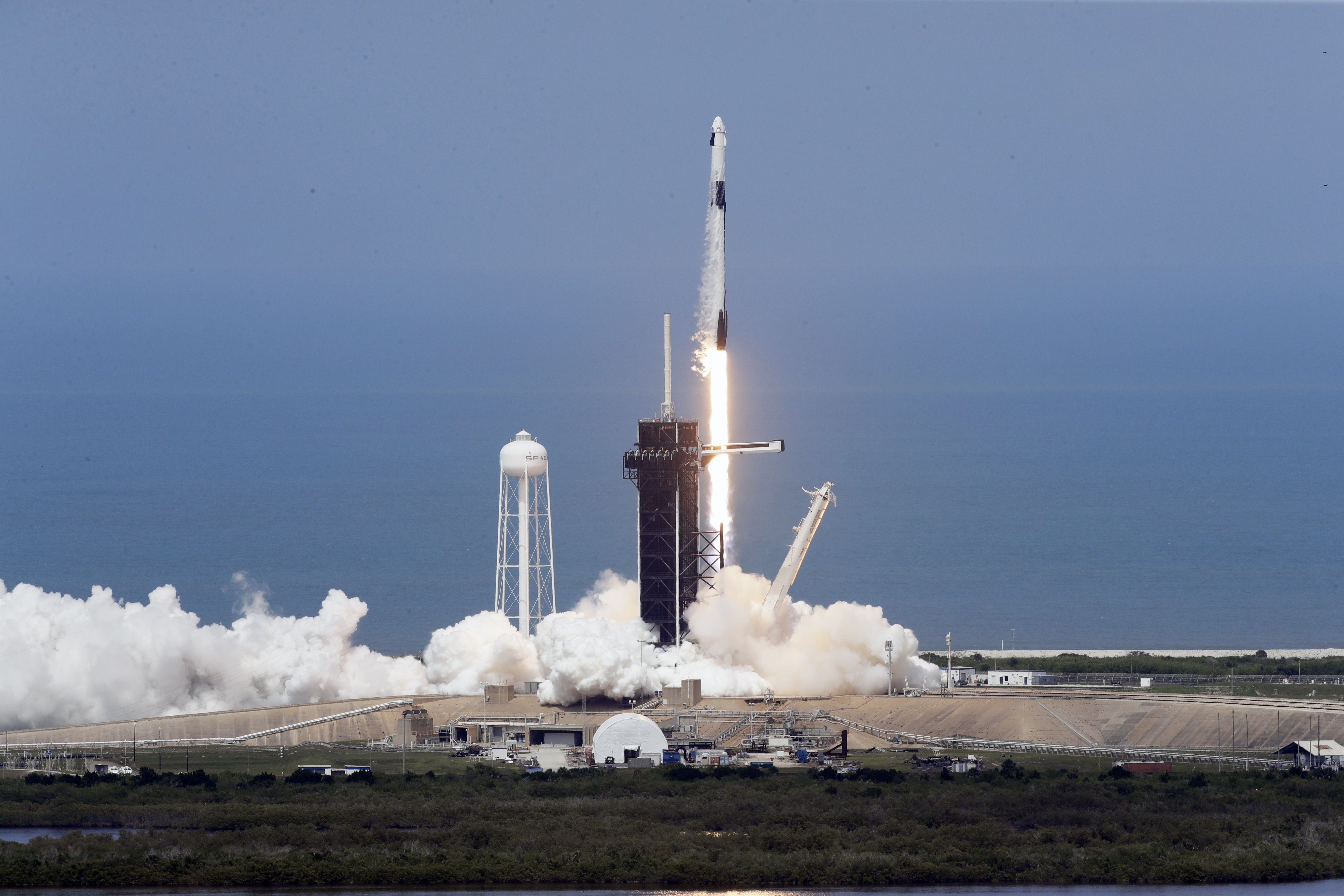 A SpaceX Falcon 9, with NASA astronauts Doug Hurley and Bob Behnken in the Dragon crew capsule, prepare to lift off as the vehicle vents fuel, from Pad 39-A at the Kennedy Space Center in Cape Canaveral, on Saturday.