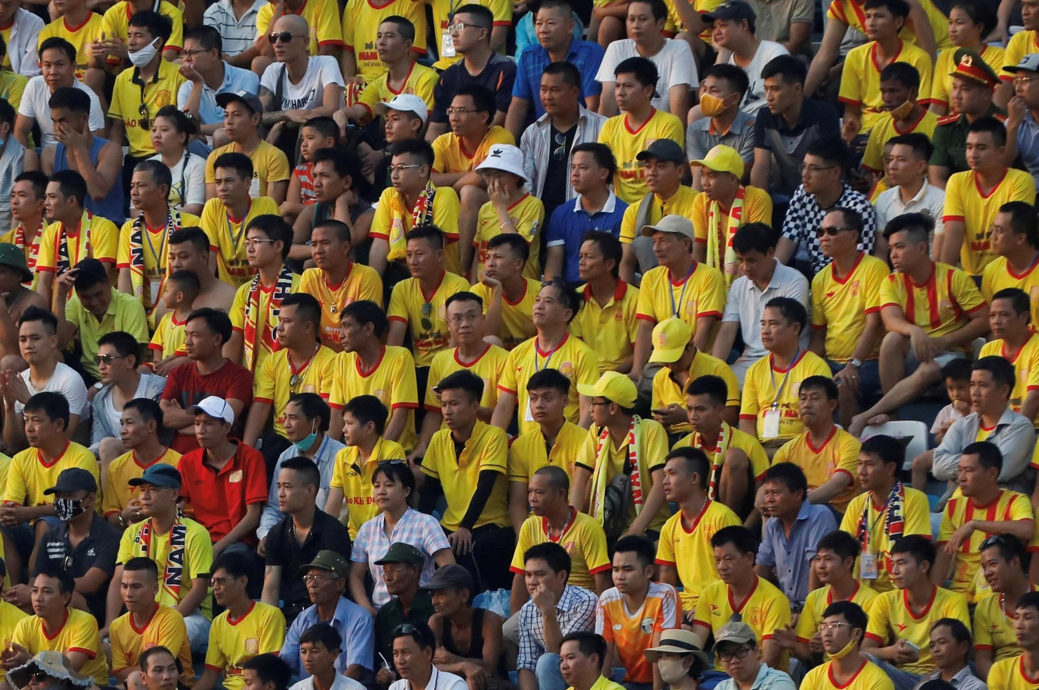 Fans flood football stadium as top-flight football restarts in Vietnam without social distancing