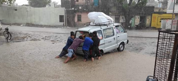 people struglling in rain