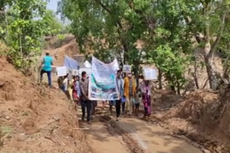 tribals rally against maoist attacks on road working vehicles