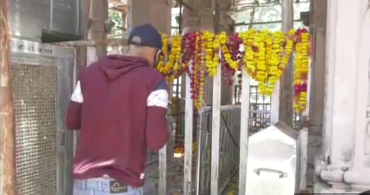 Devotees visit outside the temple