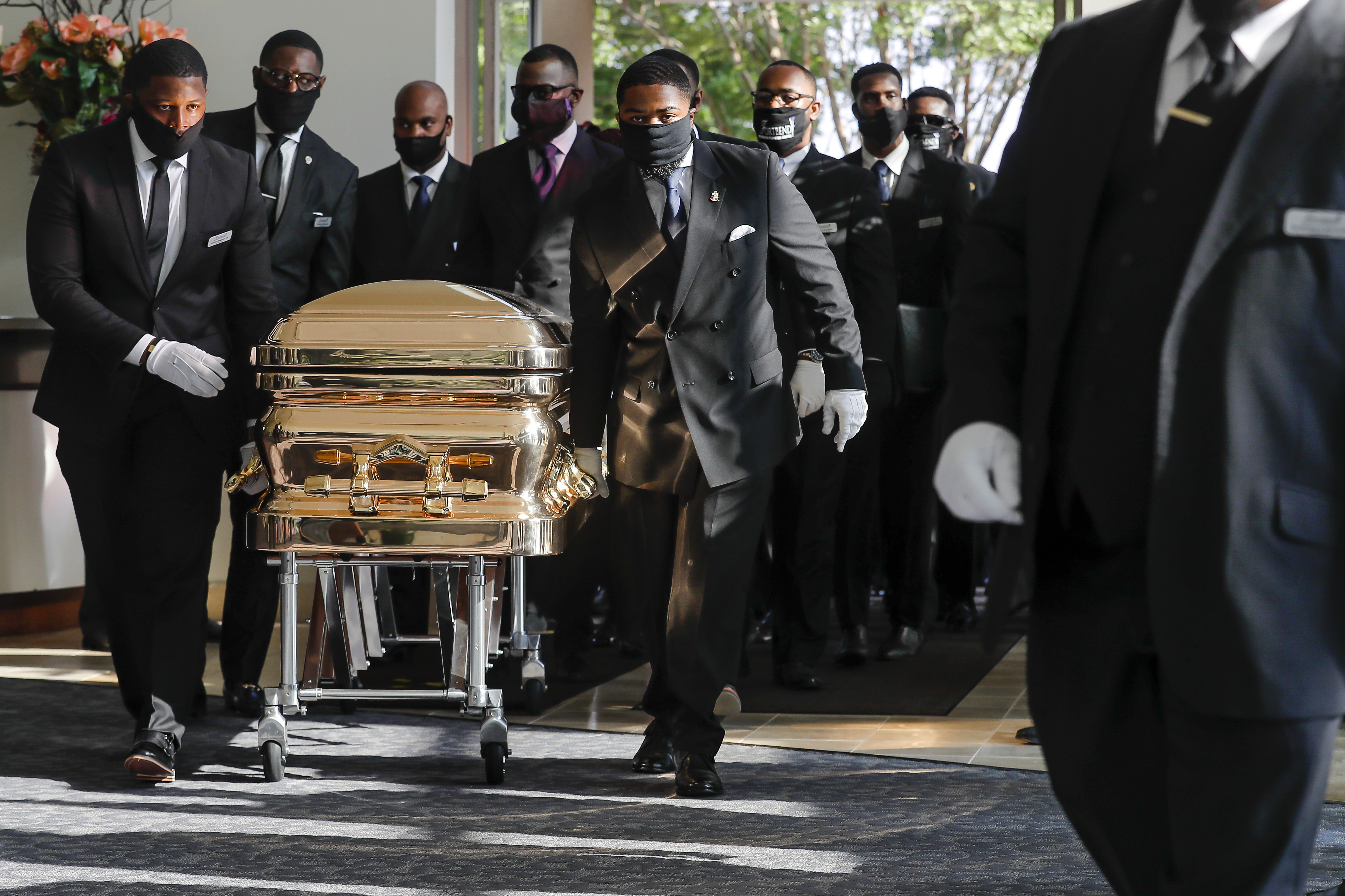 Pallbearers bring the coffin into The Fountain of Praise church in Houston for the funeral for George Floyd on Tuesday.