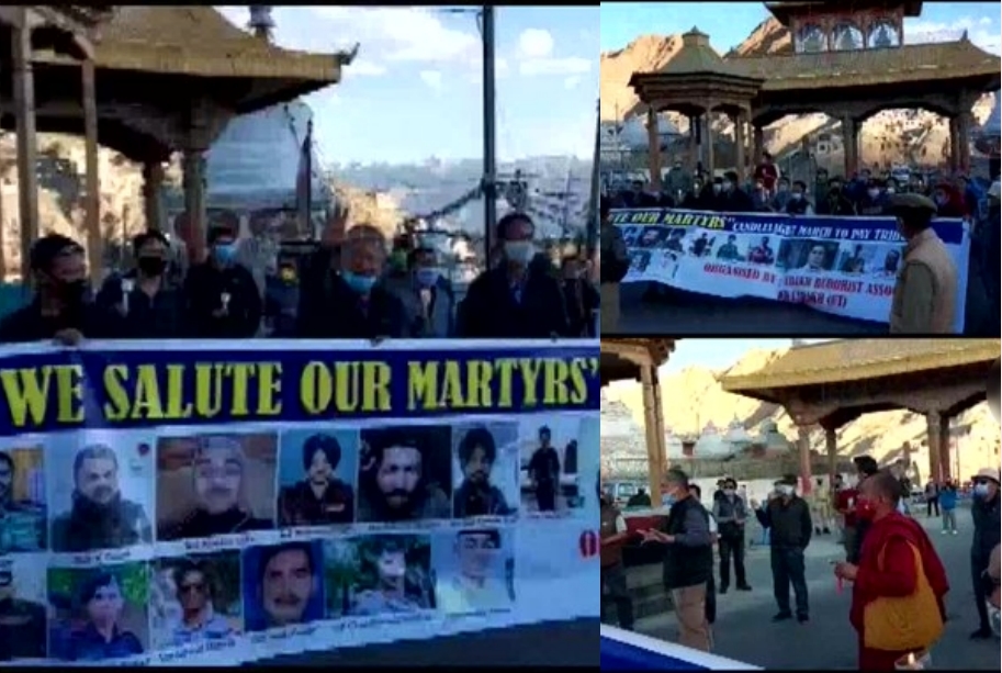 People under the banner of Ladakh Buddhists Association pay homage to martyres