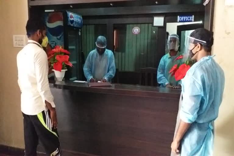 The Staff of a Hotel in Mahabubnagar wears PPE Kits while serving food.