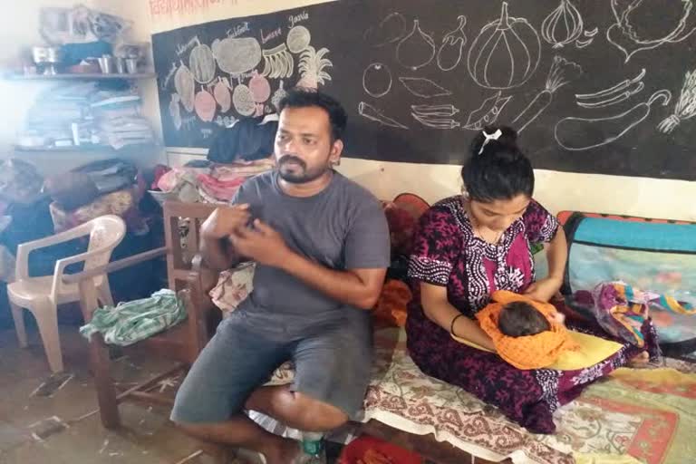 Family with new born child live in school