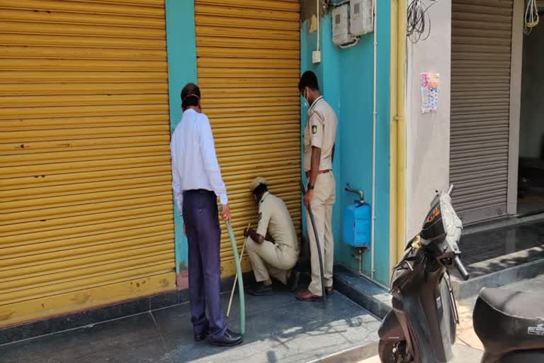 Sedam tahashildar hold lathi to control crowd