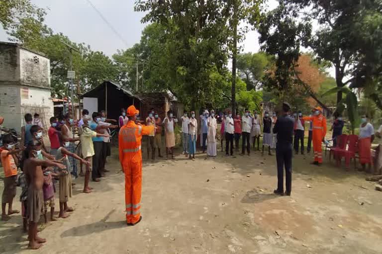 ndrf team conducts awareness campaign on rescue from corona