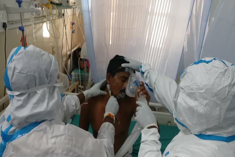   A young man doing haircut to the corona infected people in hospital