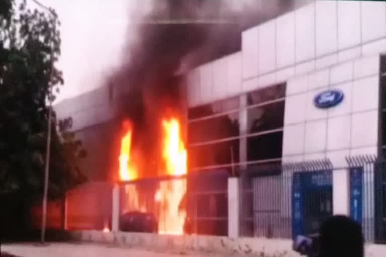 fire in ford car showroom in gurugram