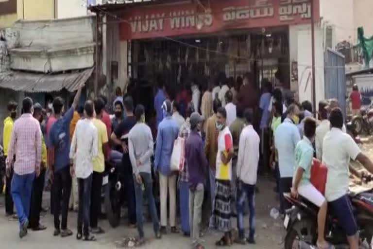 hyderabad people quee infront of wine shops