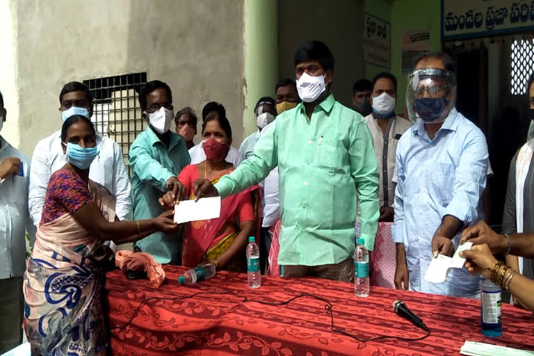 cheques distribution in narsampet constituency