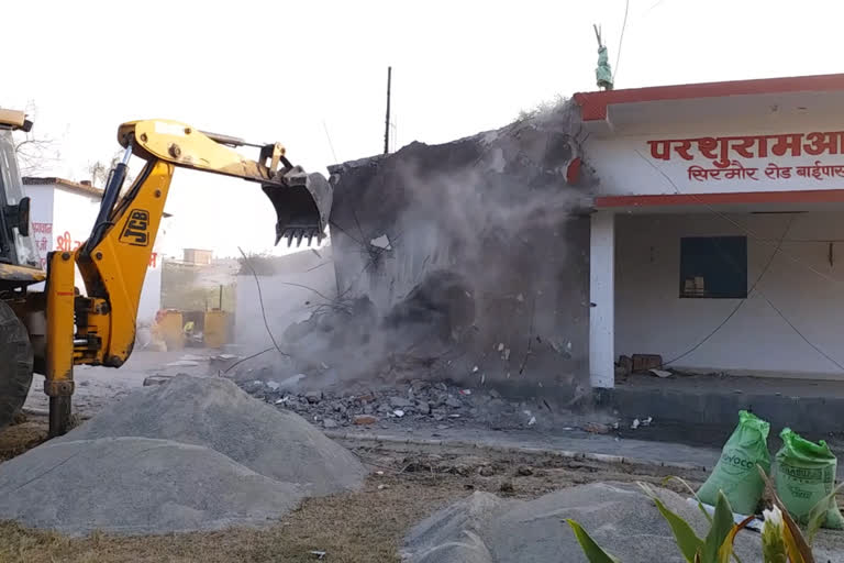 Administration bulldozer on ashram