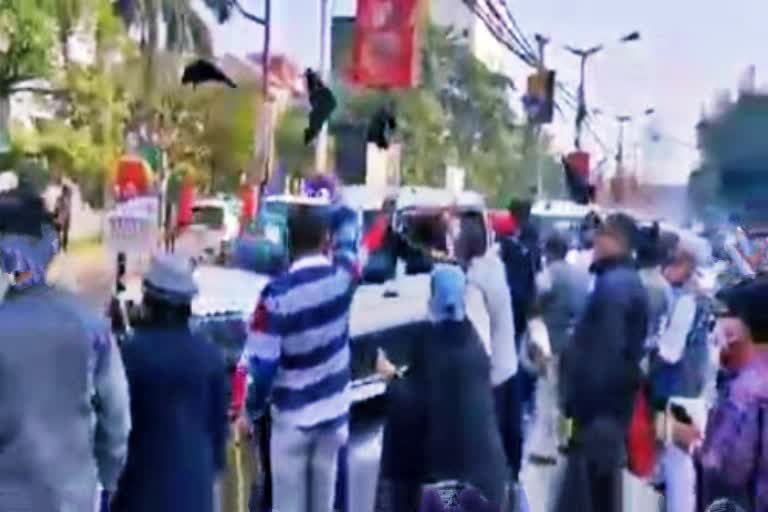 Central minister Anurag Thakur shown black flag in kolkata by cpim workers .