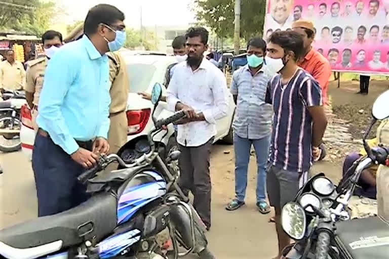 Adilabad district transport officials are conducting an extensive campaign on helmet retention