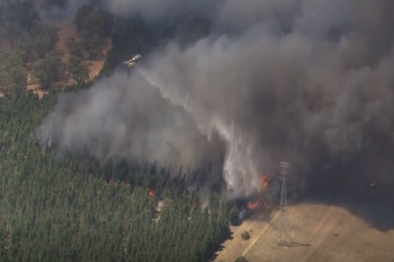 Bushfire burning out of control north of Perth