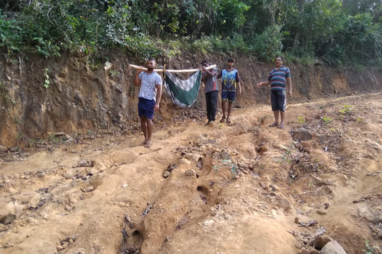 woman carried on makeshift stretcher