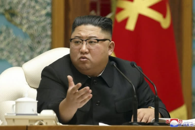 Kim vows to improve ties with outside world at party meeting