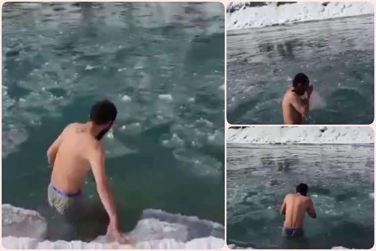 youth take bath in icy Chandrabhaga