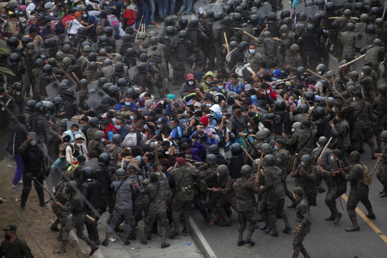 Guatemala forces stall migrant caravan with tear gas, batons