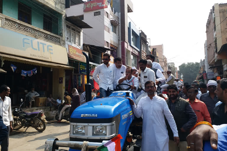 Arun Yadav riding a tractor