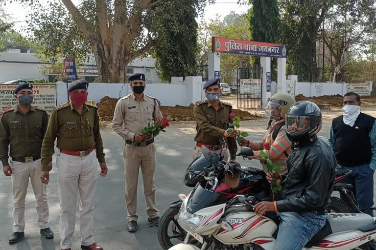 Police gave roses to bikers wearing helmets