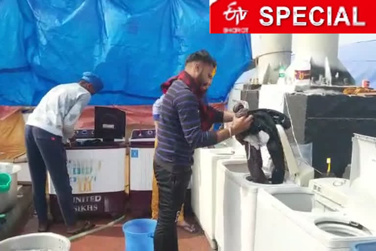 washing clothes of farmers with washing machine for free at gazipur border