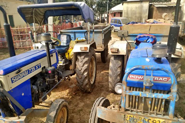 sand loaded two tractor seized