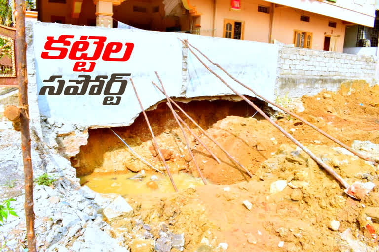 locals shocked after seeing sticks support to compound wall in kukatpally