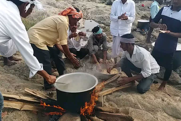 Garlic with Ganga water and offered as an offering to Godavari in adilabad district