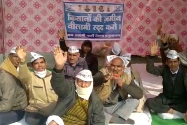 hnumangarh news, aap protested, farmer land auction