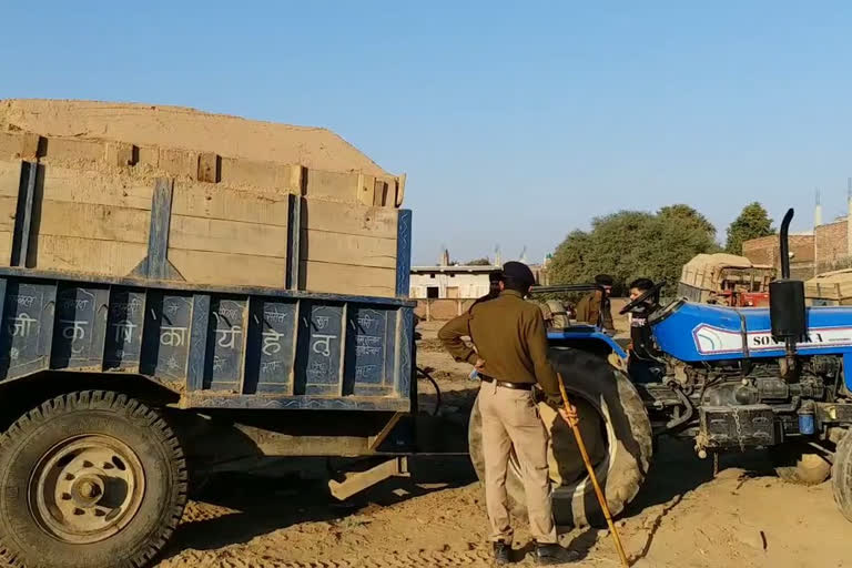 trolleys transporting illegal sand