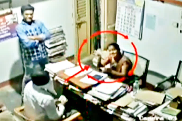 cctv showed the officer took the bribe in srikakulam district