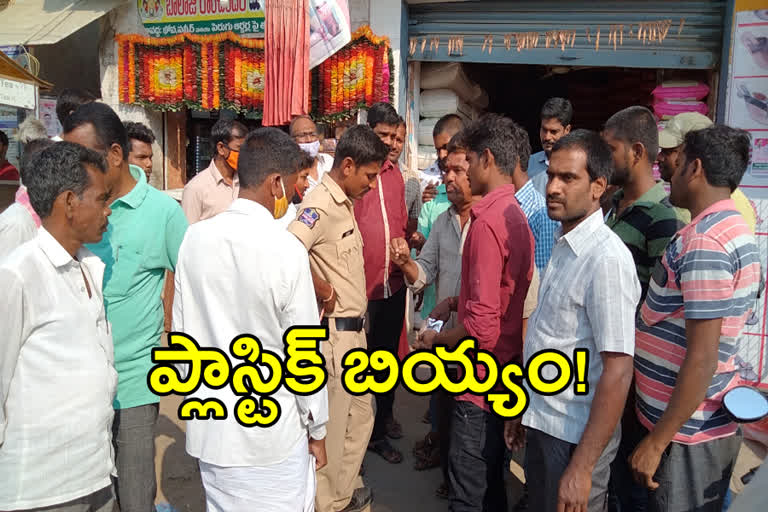 Consumers worried in front of the store that plastic rice was being sold at mothkur in yadadri bhuvanagiri