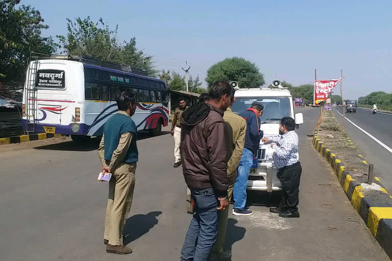 Officers checking buses