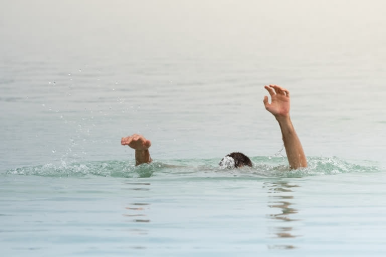 two boys drummed in river