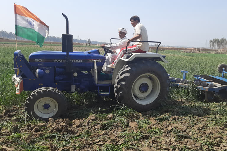 kharkhoda tractor over wheat crop