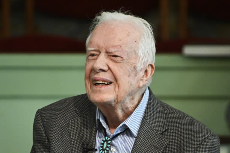 Vaccinated for virus, Jimmy Carter & wife back in church