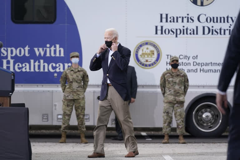 Biden surveys Texas weather damage, encourages virus shots