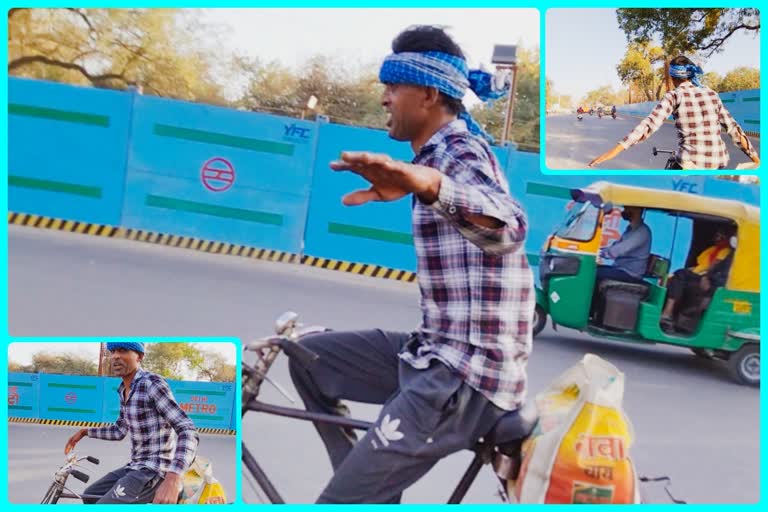 A man fearlessly riding on bicycle on the road full of traffic putting others life in danger as well as himself