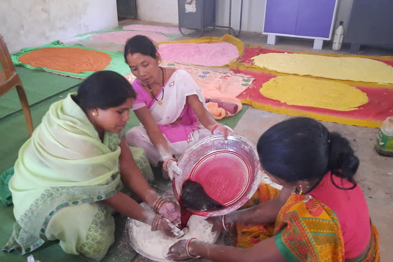 Women making herbal gulal