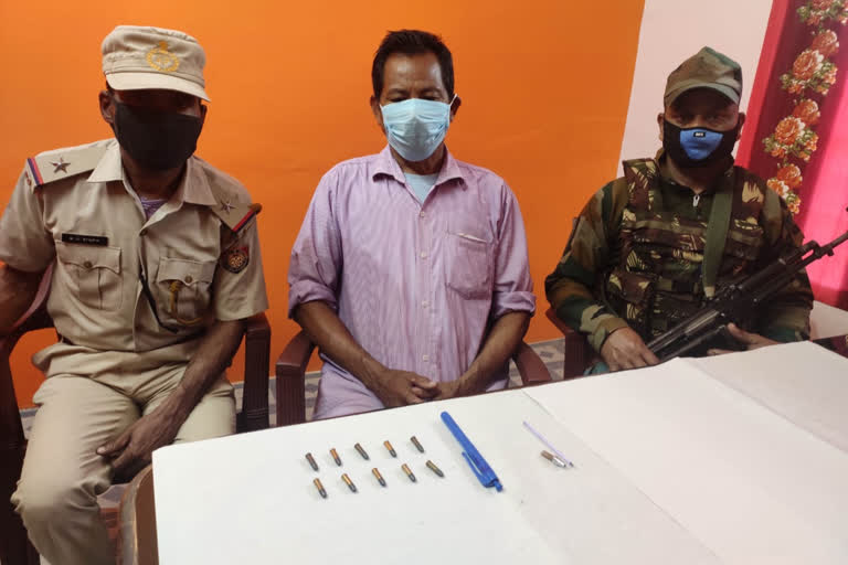 assam police arrested a men with chinese pen gun with 10 bluets